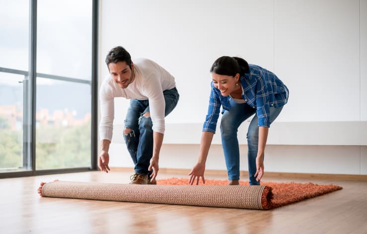 https://www.loveyourrug.ca/wp-content/uploads/2019/05/rolling-out-area-rug.jpg