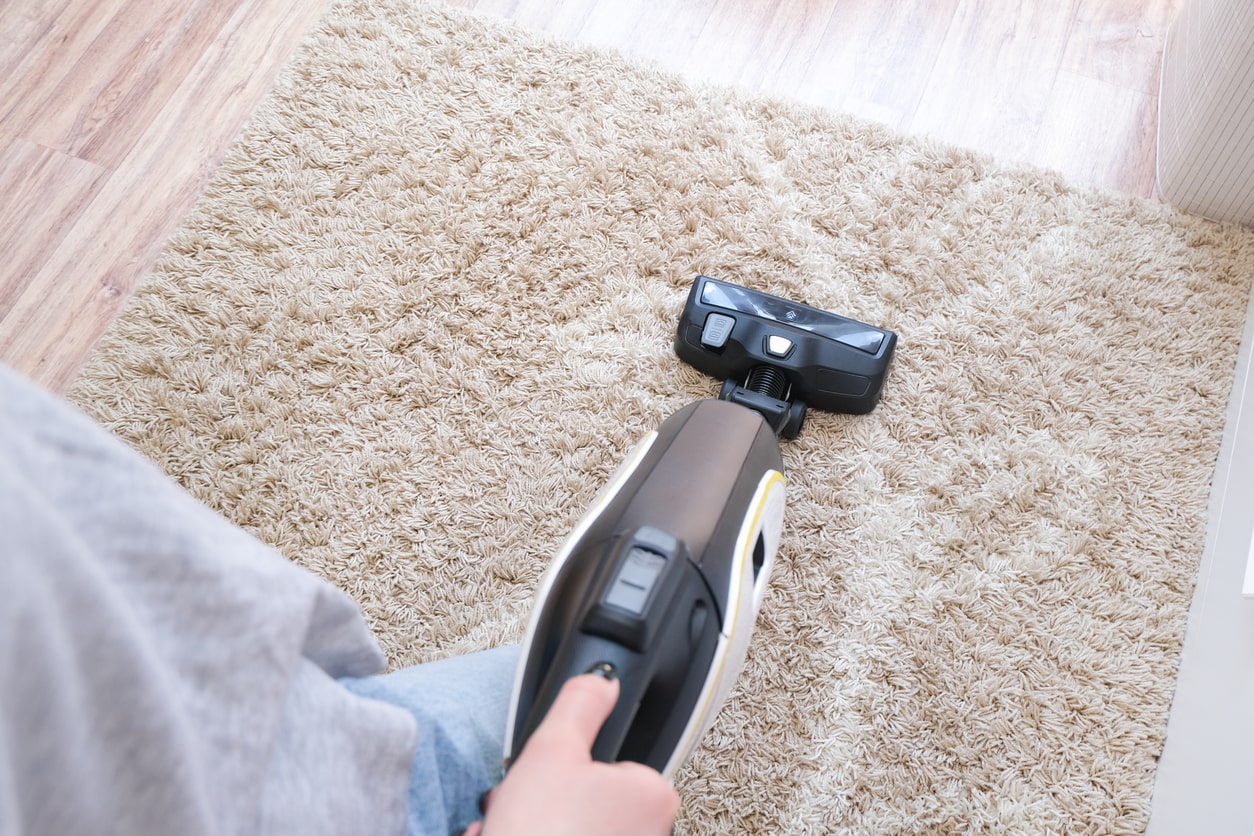 vaccuming a wool rug